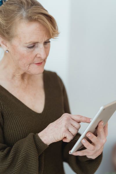 Check the boxes of those present, or just record the totals Woman using her tablet/ipad screen